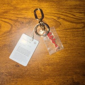 Lululemon Metal Script Keychain in Lululemon Red & Gold